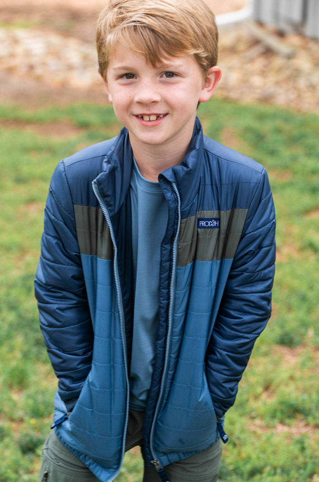 navy and denim blue cold-weather coat with zip pockets for boys