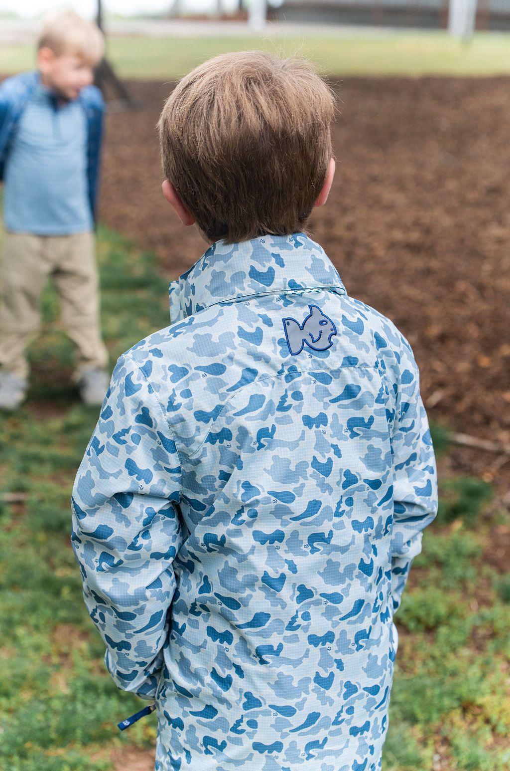 Waterproof nylon kids rain jacket in vibrant blue camo