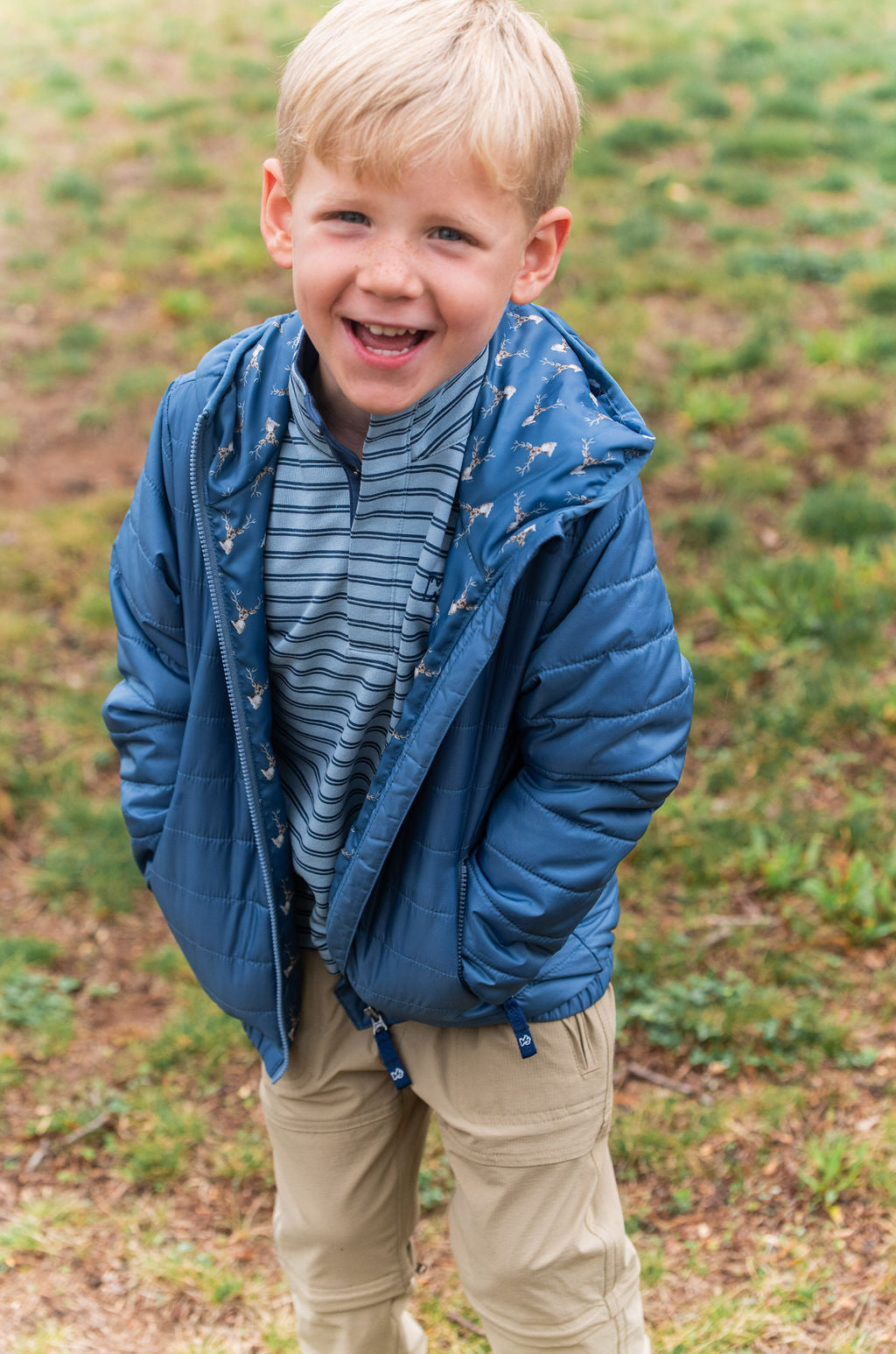 boys winter coat with deer printed interior and zip pockets, sizes 12m to L12/14