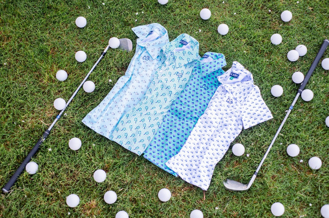multiple patterned polo shirts on grass with golf balls and clubs