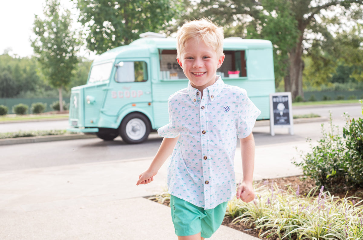 palm tree print on white short-sleeve boys button up shirt